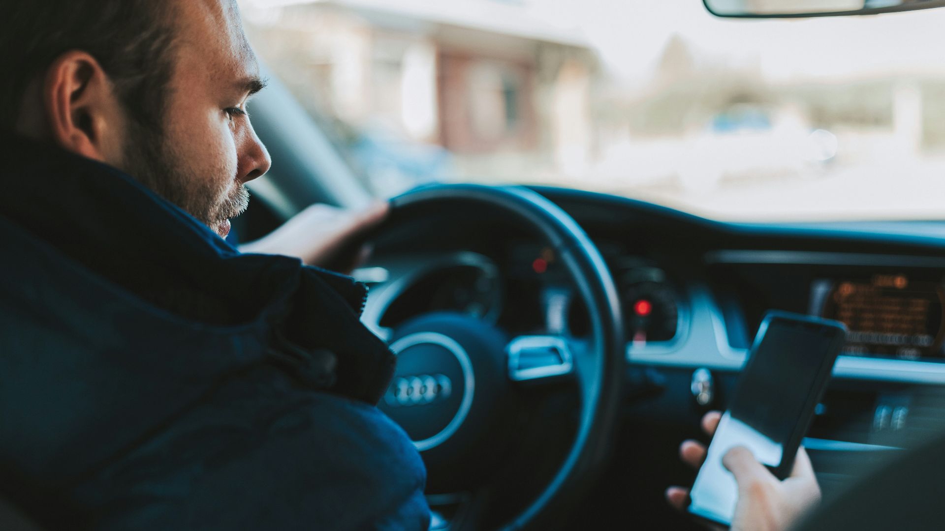 man holding black smartphone