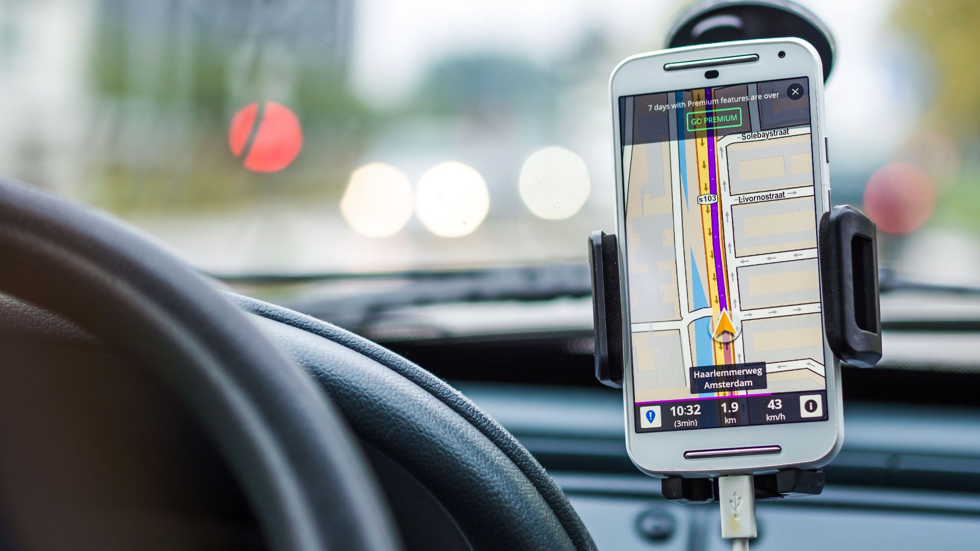 Smartphone mounted in car using GPS for navigation and directions.