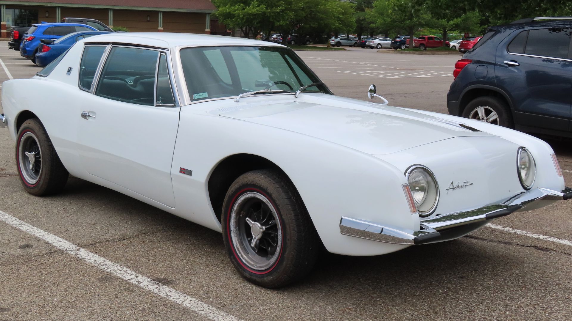 1963 Studebaker Avanti photographed in Grove City, Pennsylvania. Finished in Avanti White. This one has the optional Halibrand wheels (although they may just be replicas).