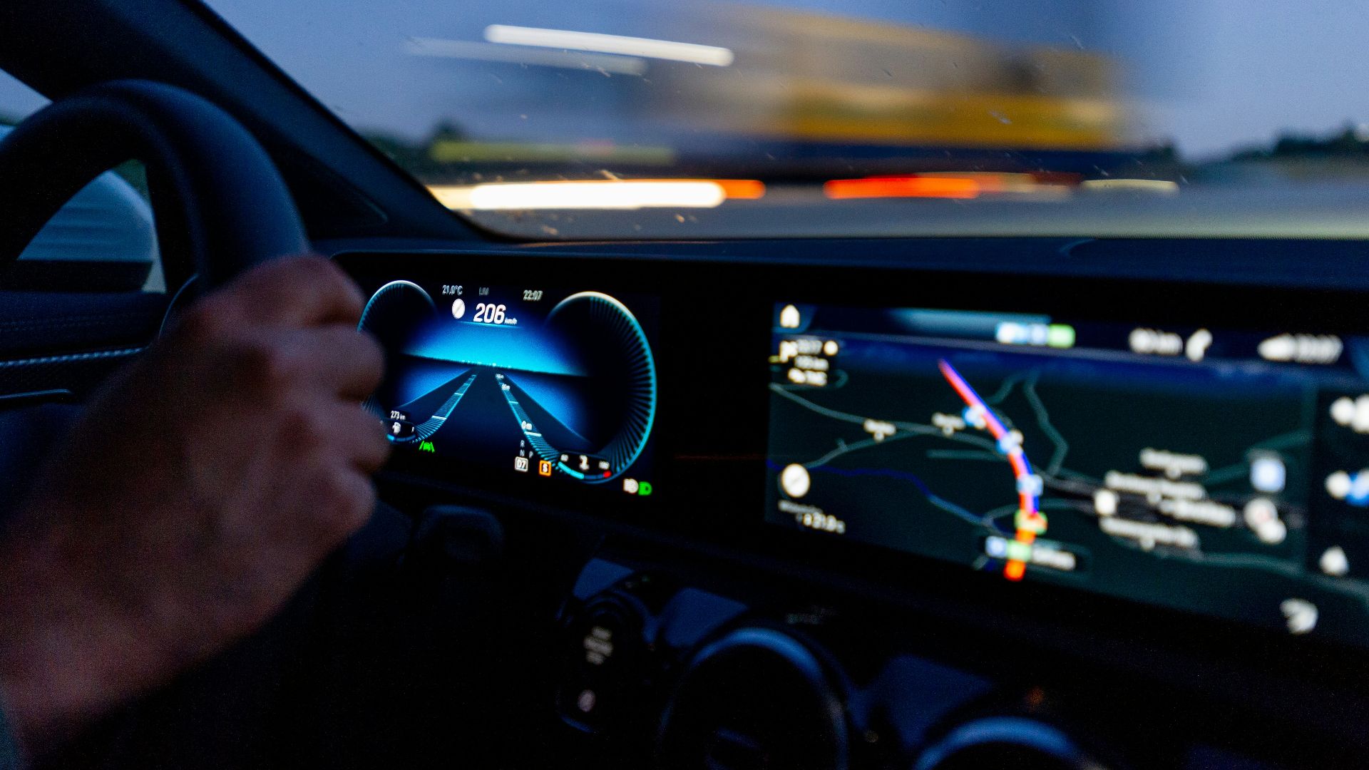 person's hand on steering wheel