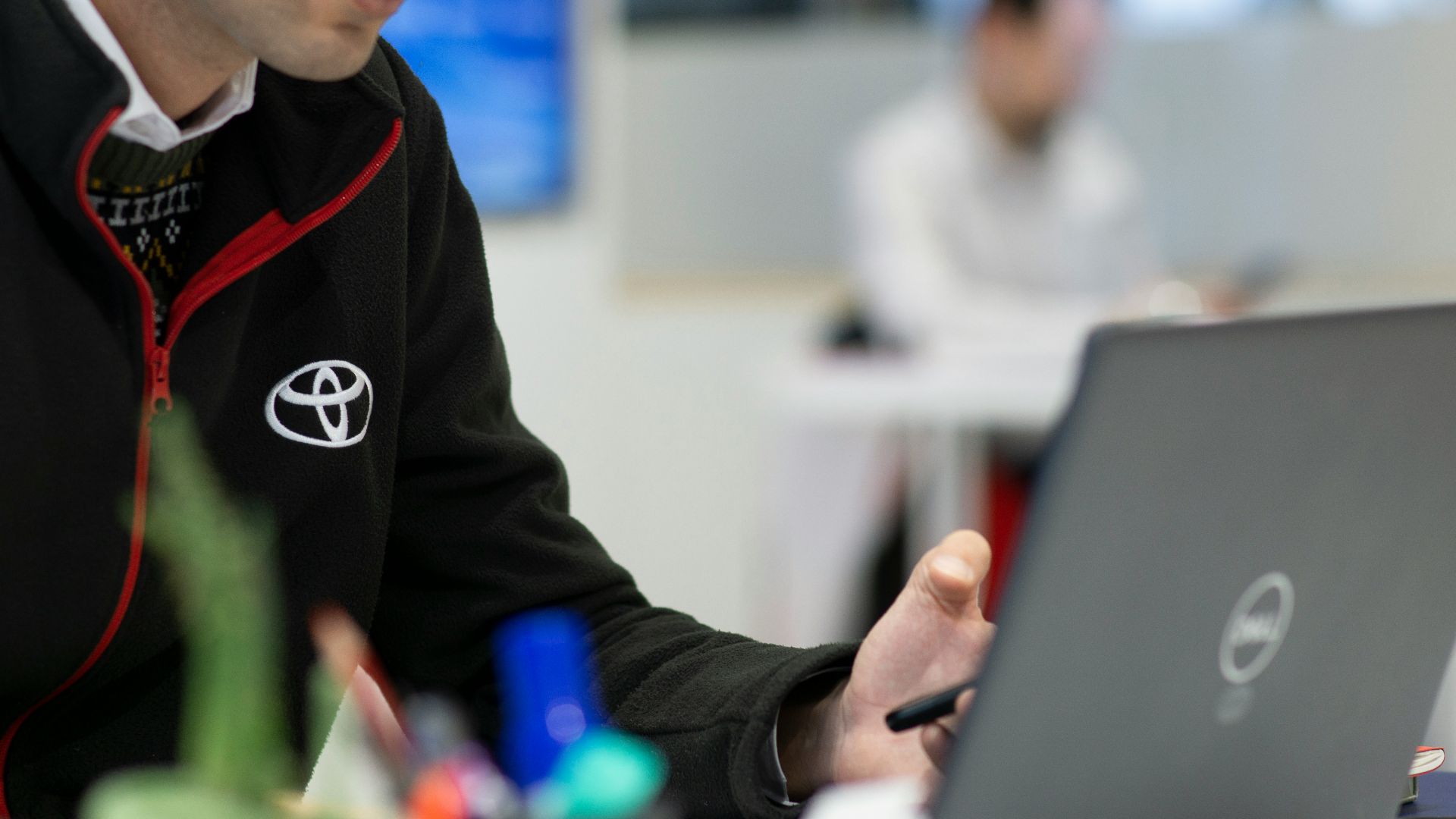 A man sitting in front of a laptop computer