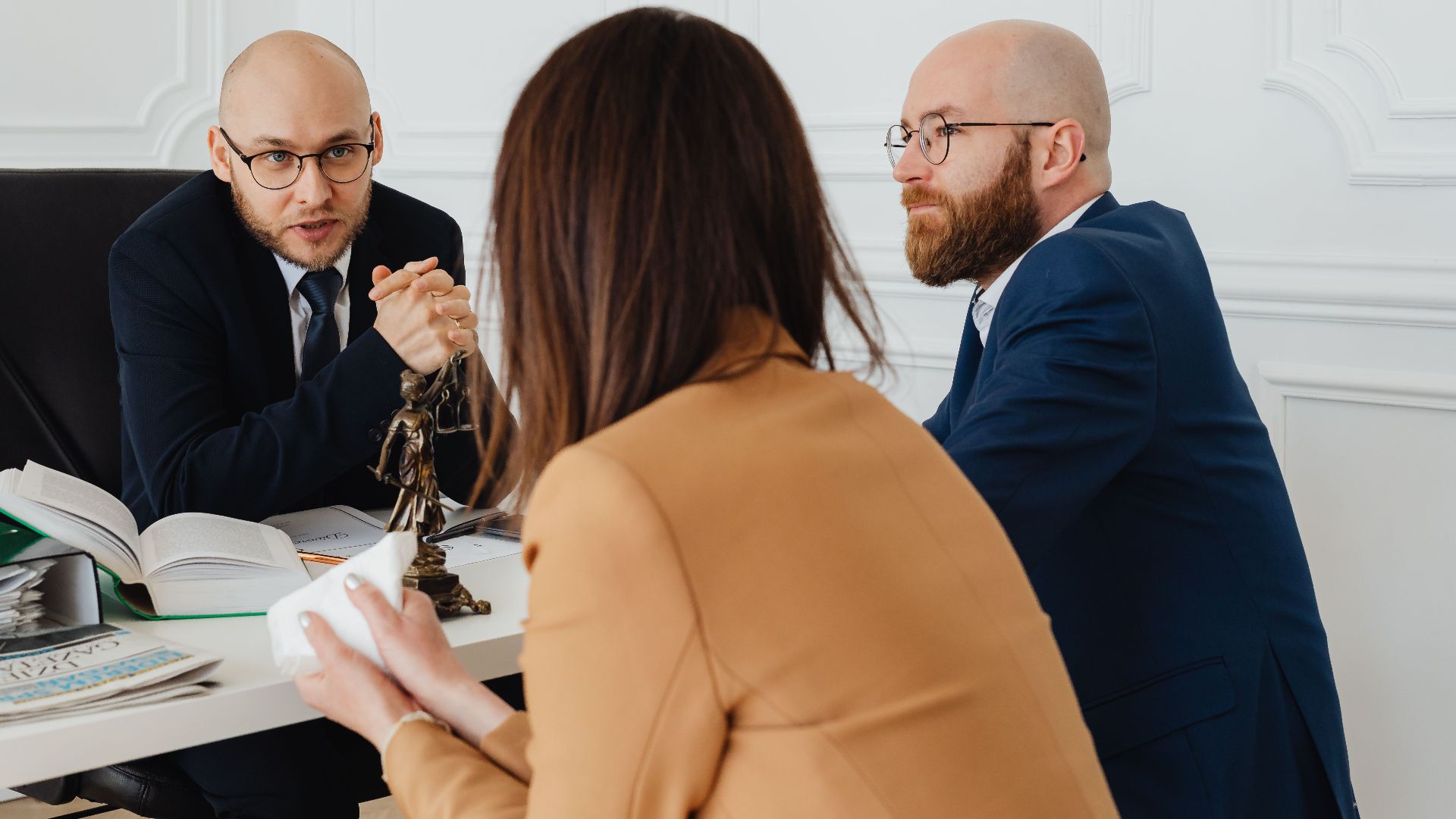 Professional discussion among lawyers in a modern office, focusing on legal matters.