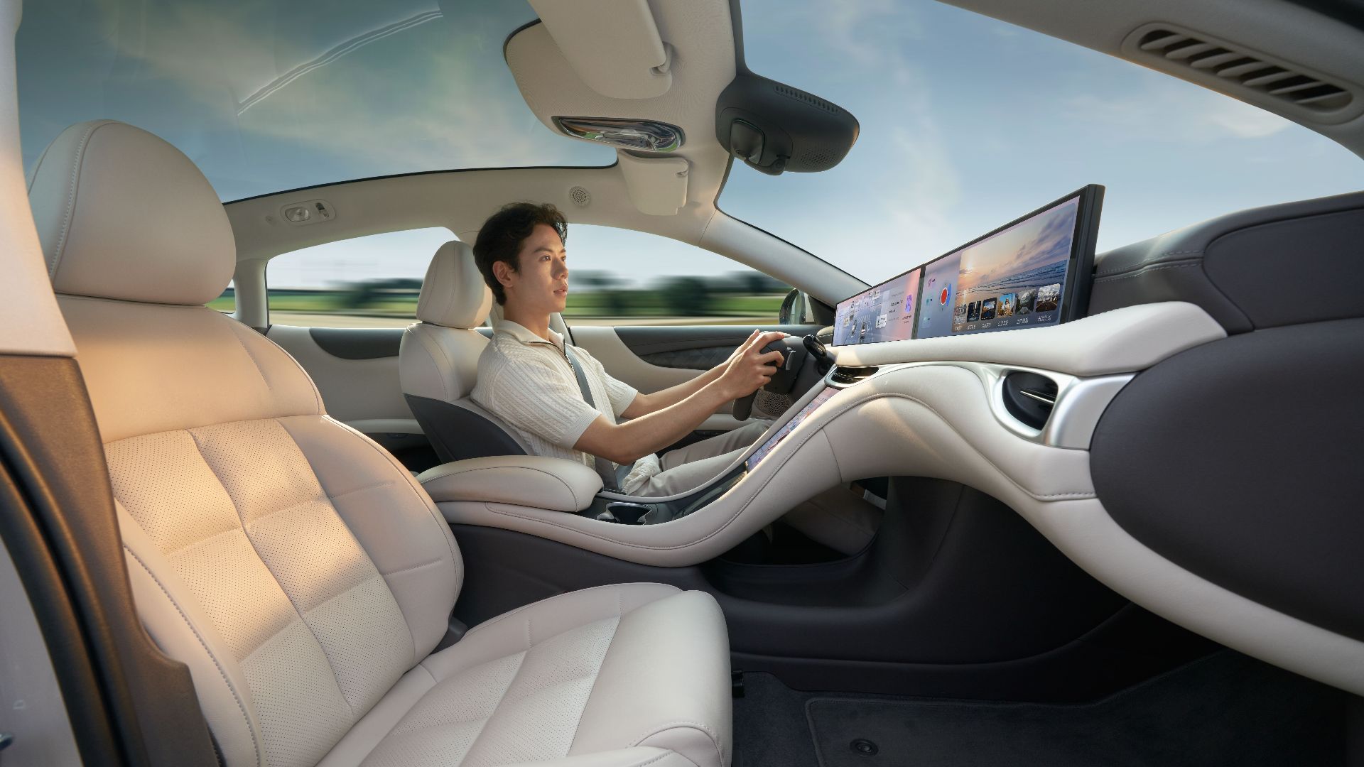 A modern electric car interior showcasing advanced technology with a driver enjoying a smooth ride.