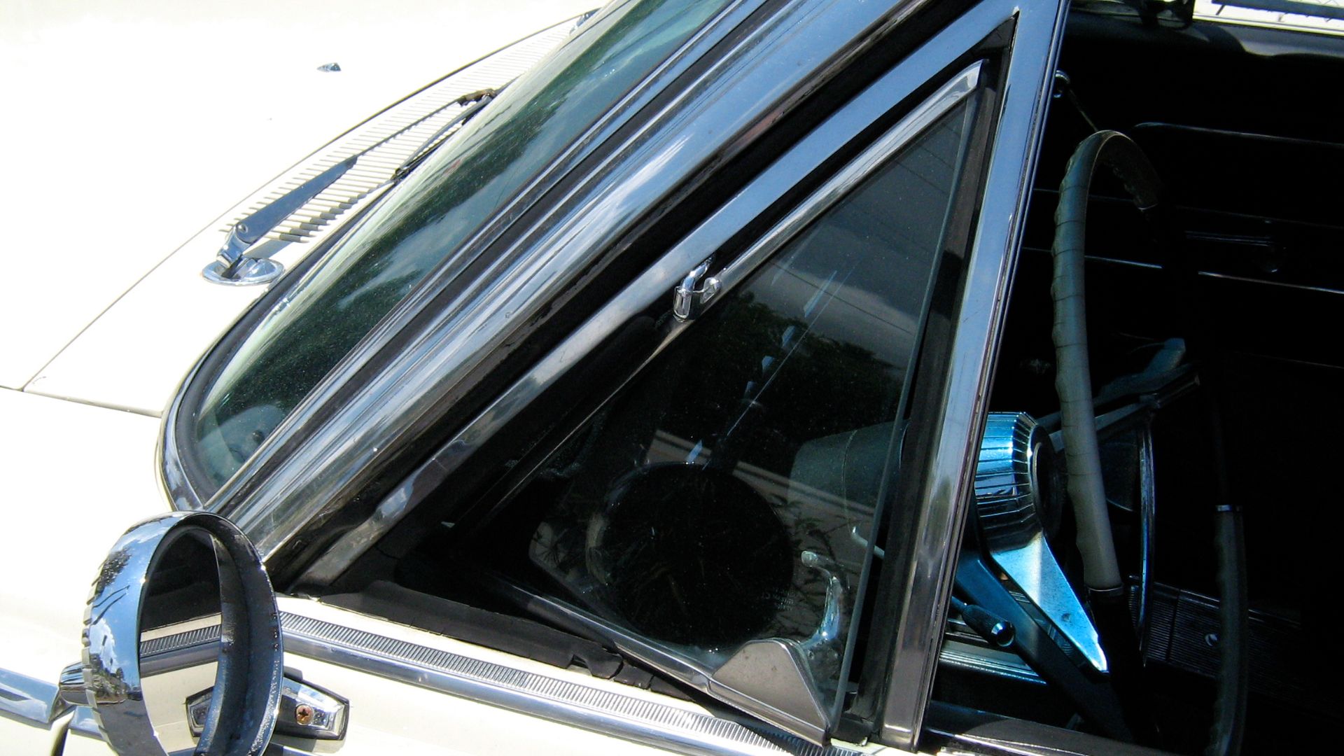 American Motors (AMC) 1965 Rambler 990 Ambassador convertible. Detail of driver's side vent window and the factory (remote adjustable) outside rear view mirror.