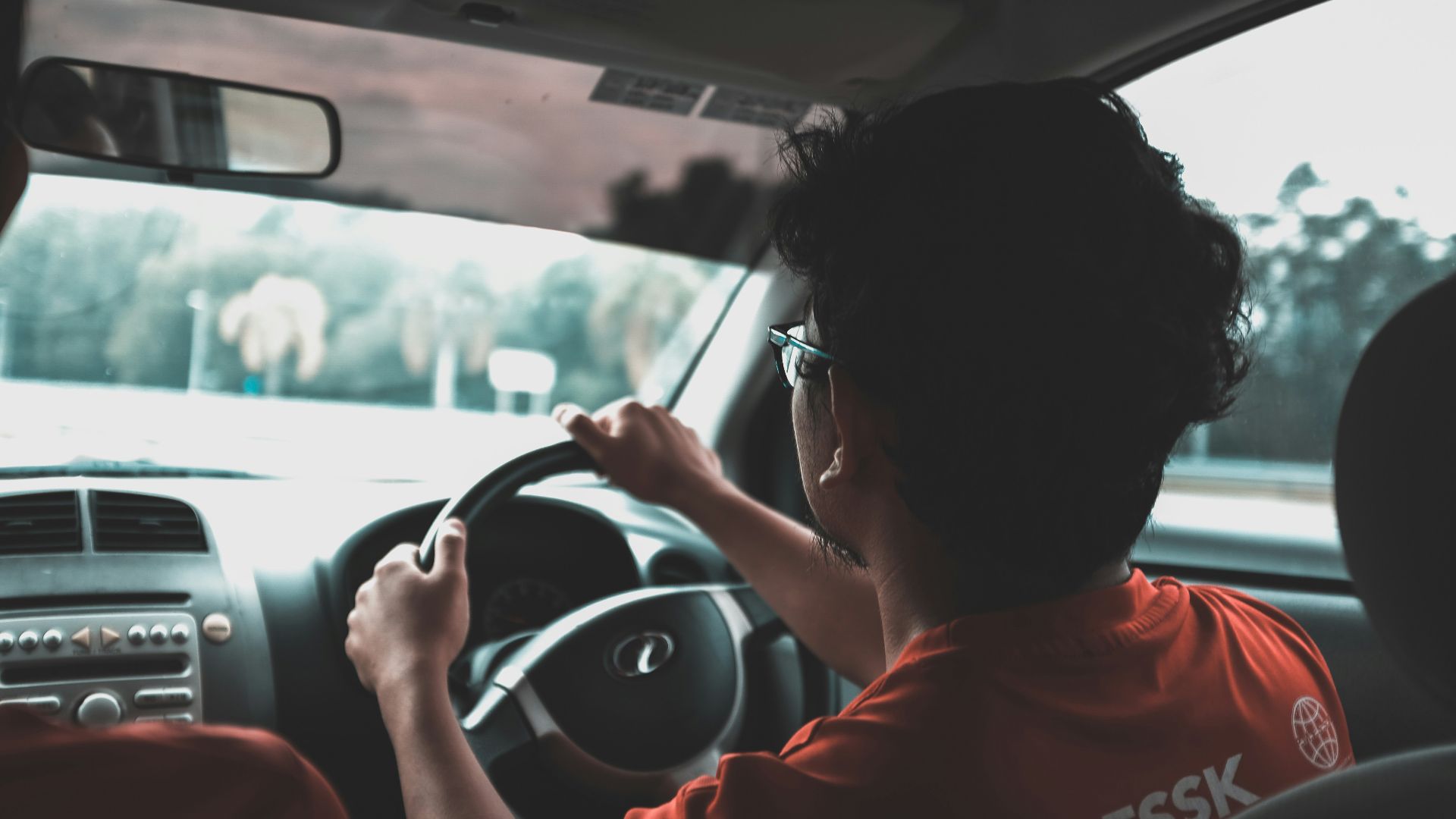 man driving car