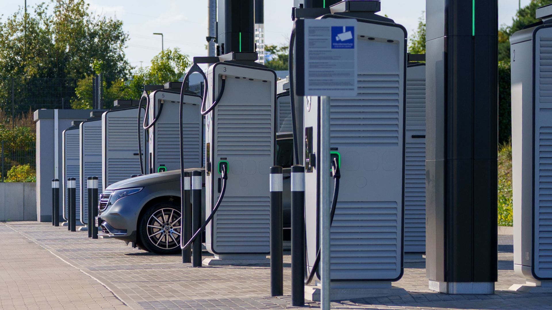 Contemporary outdoor electric vehicle charging station with sleek design and innovative technology for clean energy.