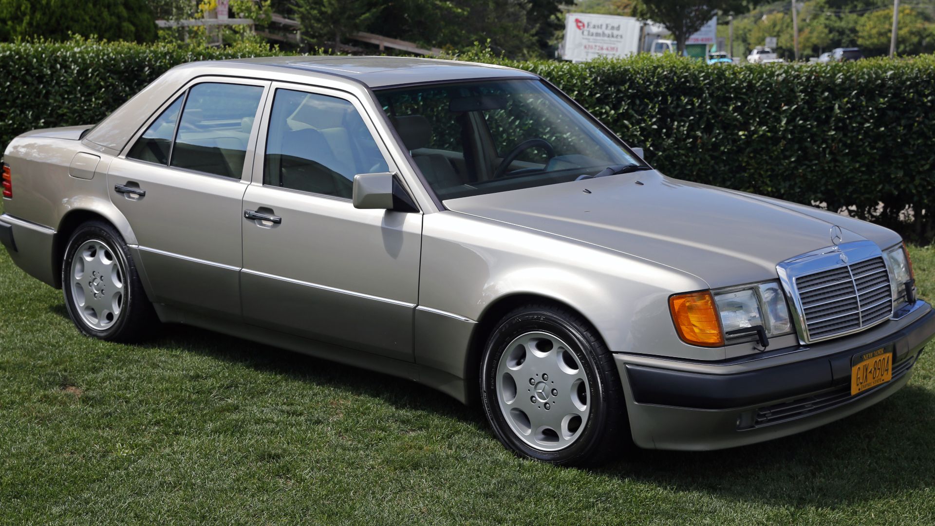 A 1992 Mercedes-Benz 500E in immaculate condition, at a classic car garage in Southampton, NY.