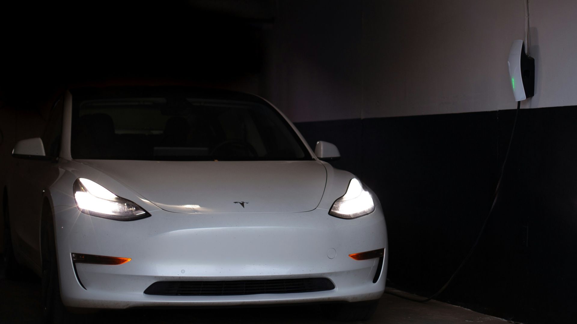 a white car is parked in a garage