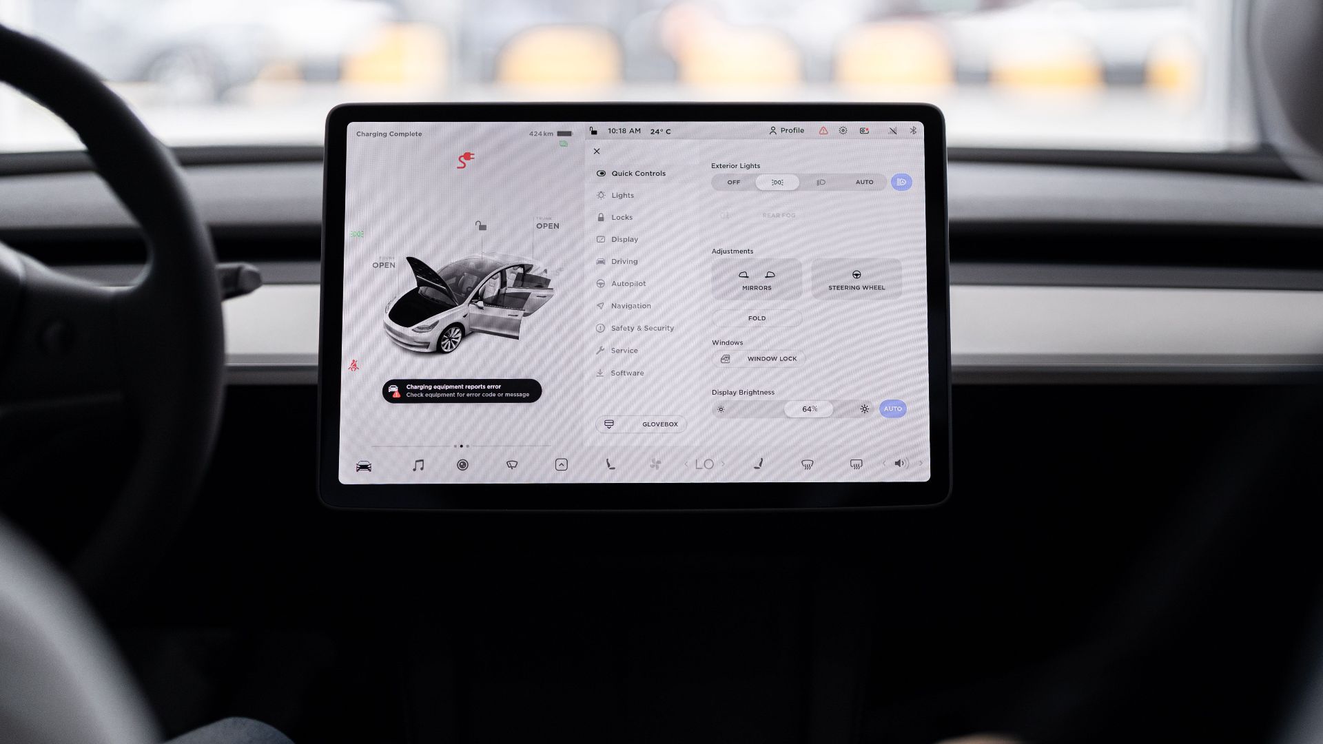 View of a modern car's dashboard featuring a digital display panel with control options.