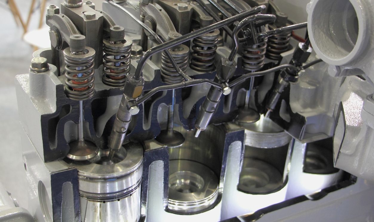 New OHV four stroke engine model in cut close up, car fuel direct injector motor - pistons, valves, injectors