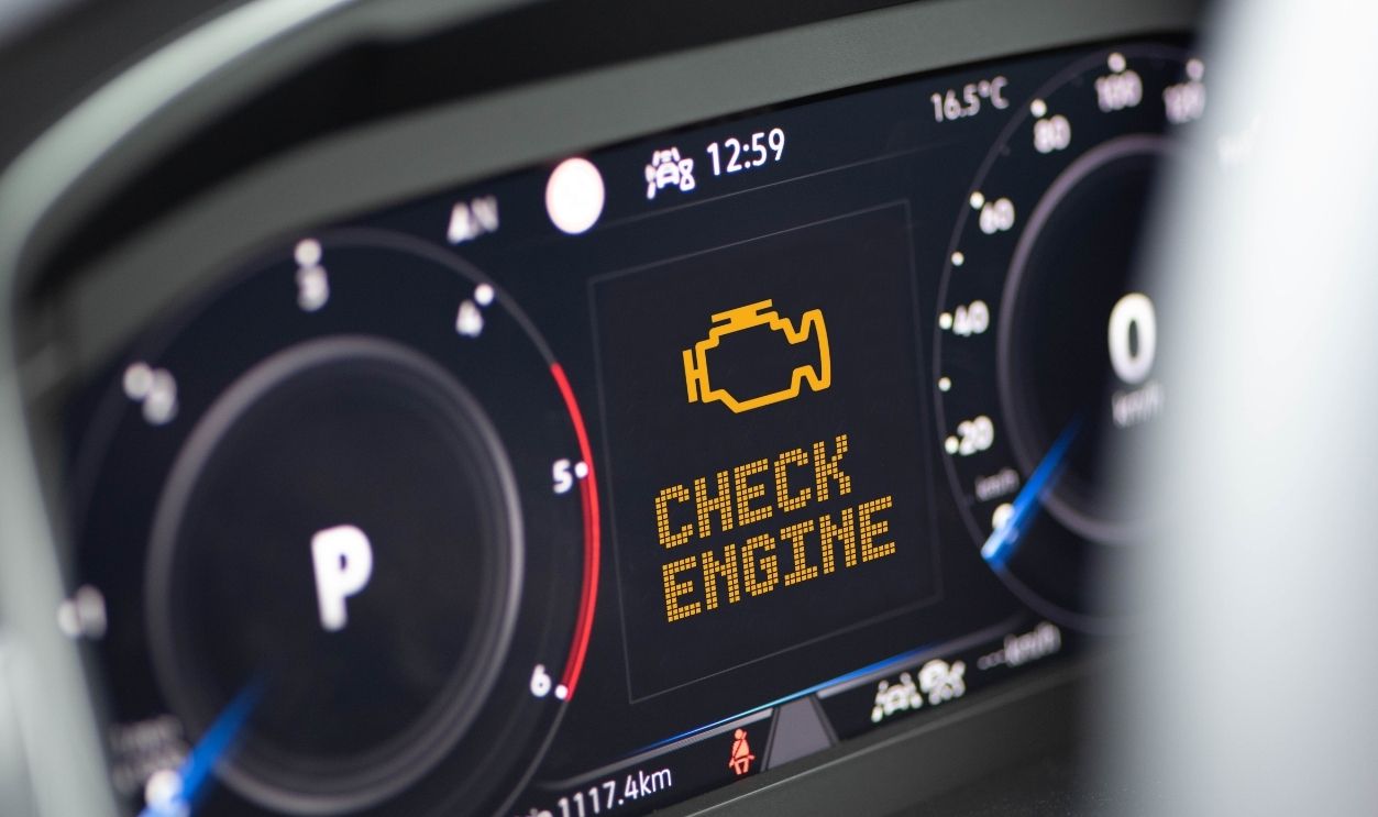 Interior of a modern car and a Check Engine warning light