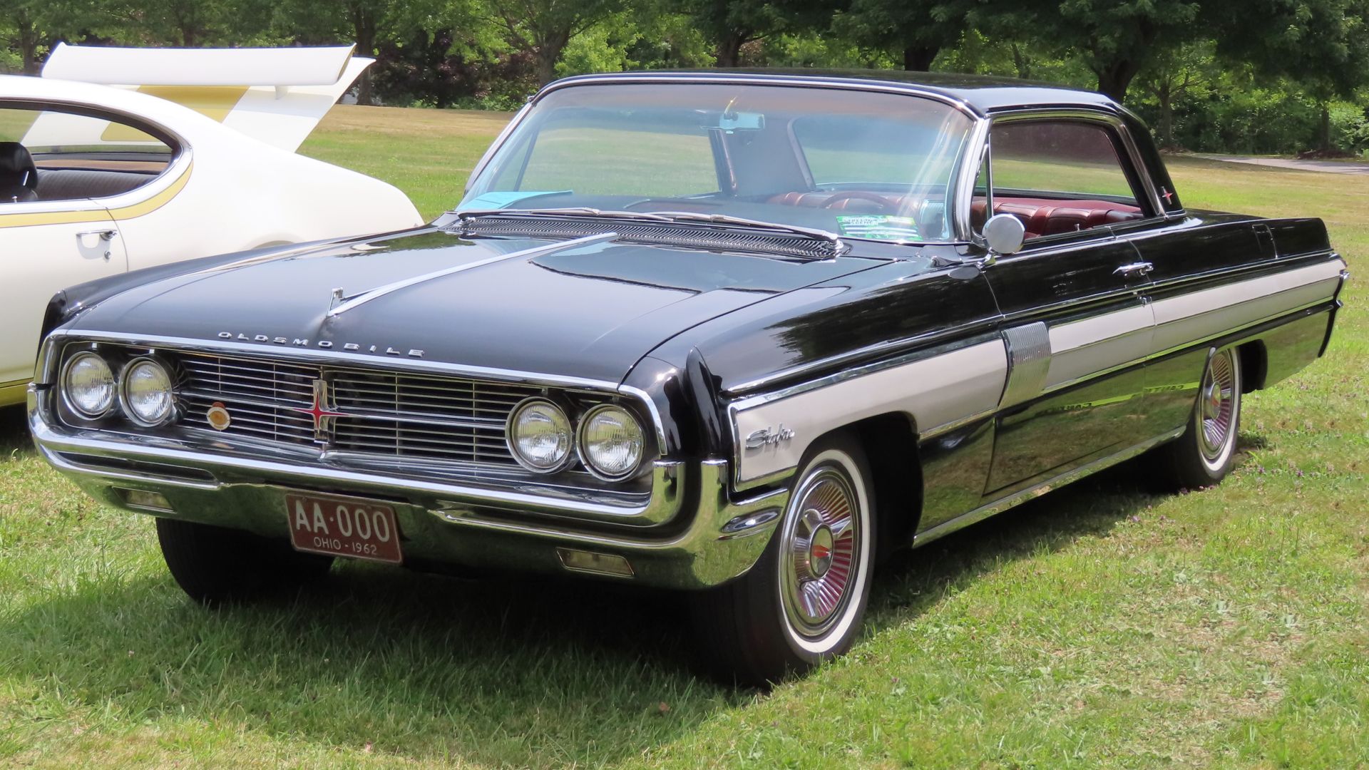 1962 Oldsmobile Starfire coupe photographed at the 12th annual Street Scene Car & Custom Bike Show in Austintown, Ohio. Finished in Ebony Black.