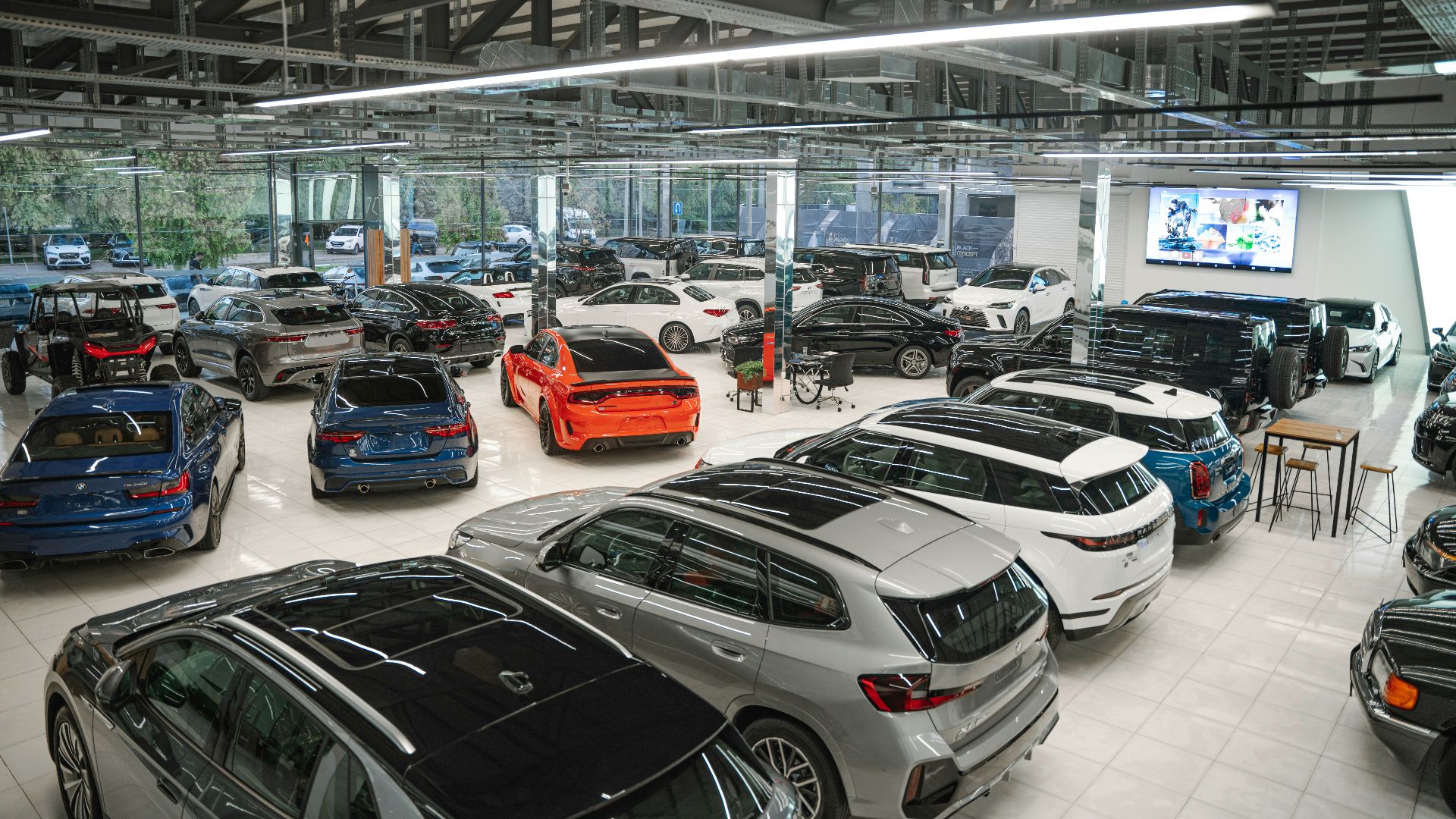 a bunch of cars are parked in a garage
