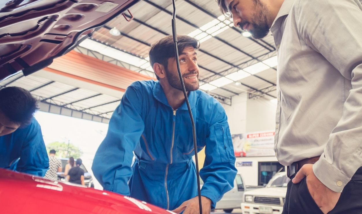 Shutterstock-1824153332, Mechanic checking car with the owner. Auto services concepts