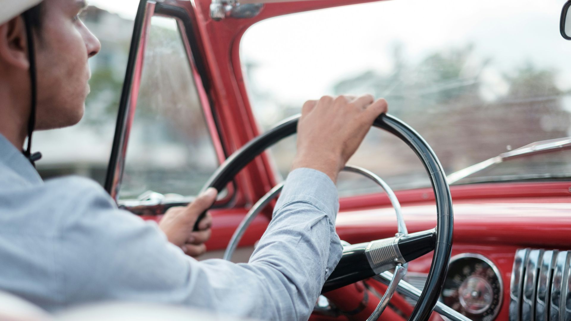 man ride on red vehicle