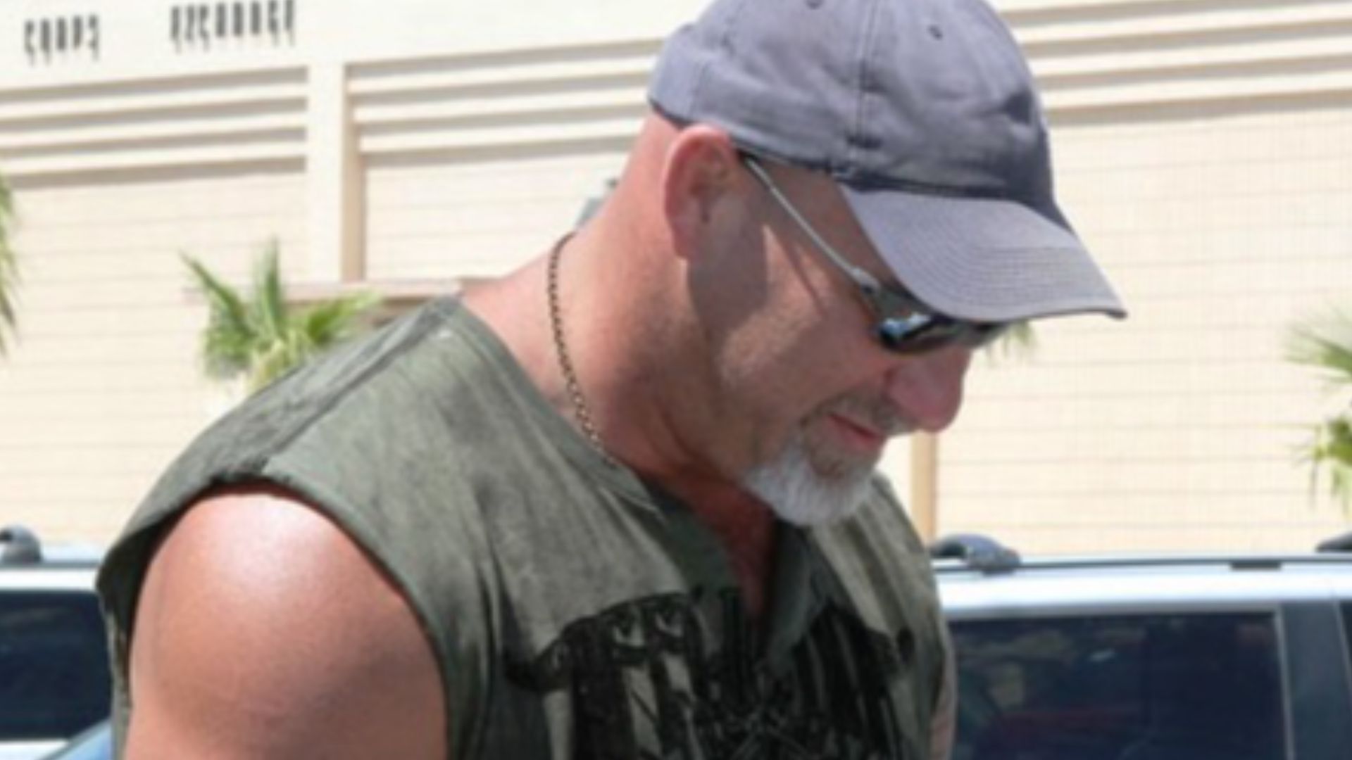 Former wrestling champion and actor Bill Goldberg autographs a promotional photo of himself.