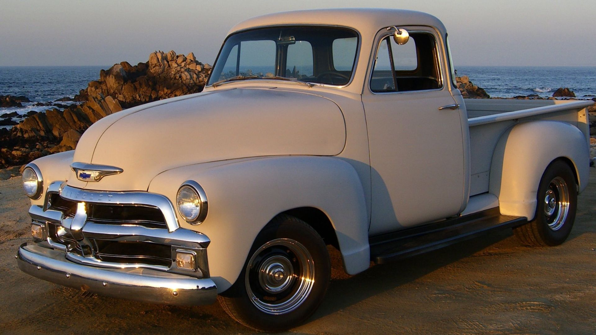 1954 Chevrolet 3100 deluxe-cab ½-ton pickup in primer. Lowered. Non-stock 15 in. Rallye wheels.