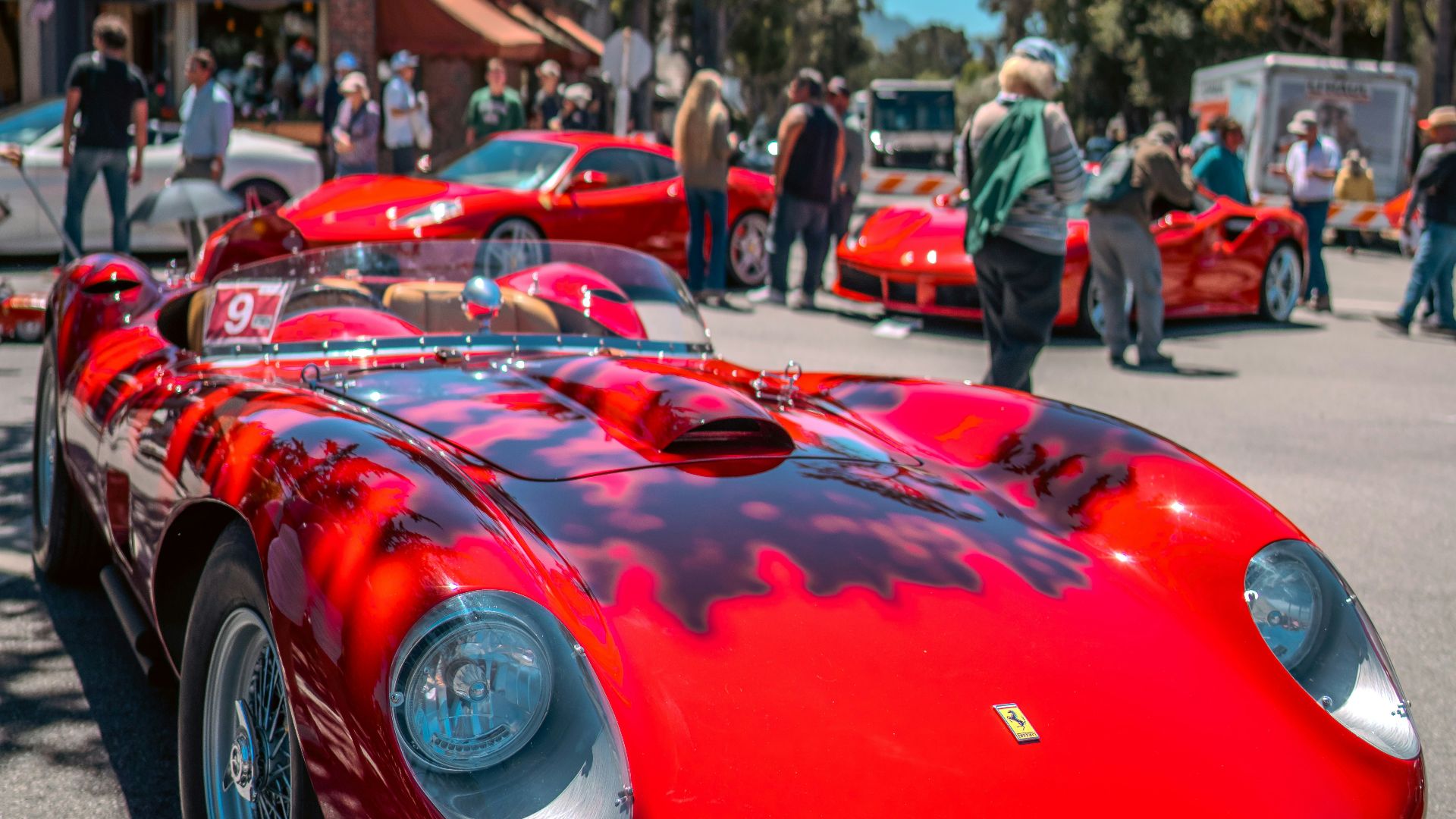 A red sports car parked on the side of a road