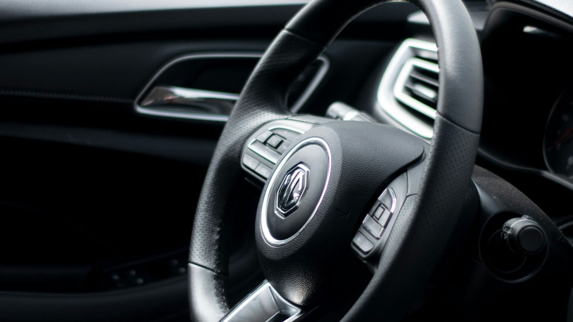 black and silver mercedes benz steering wheel