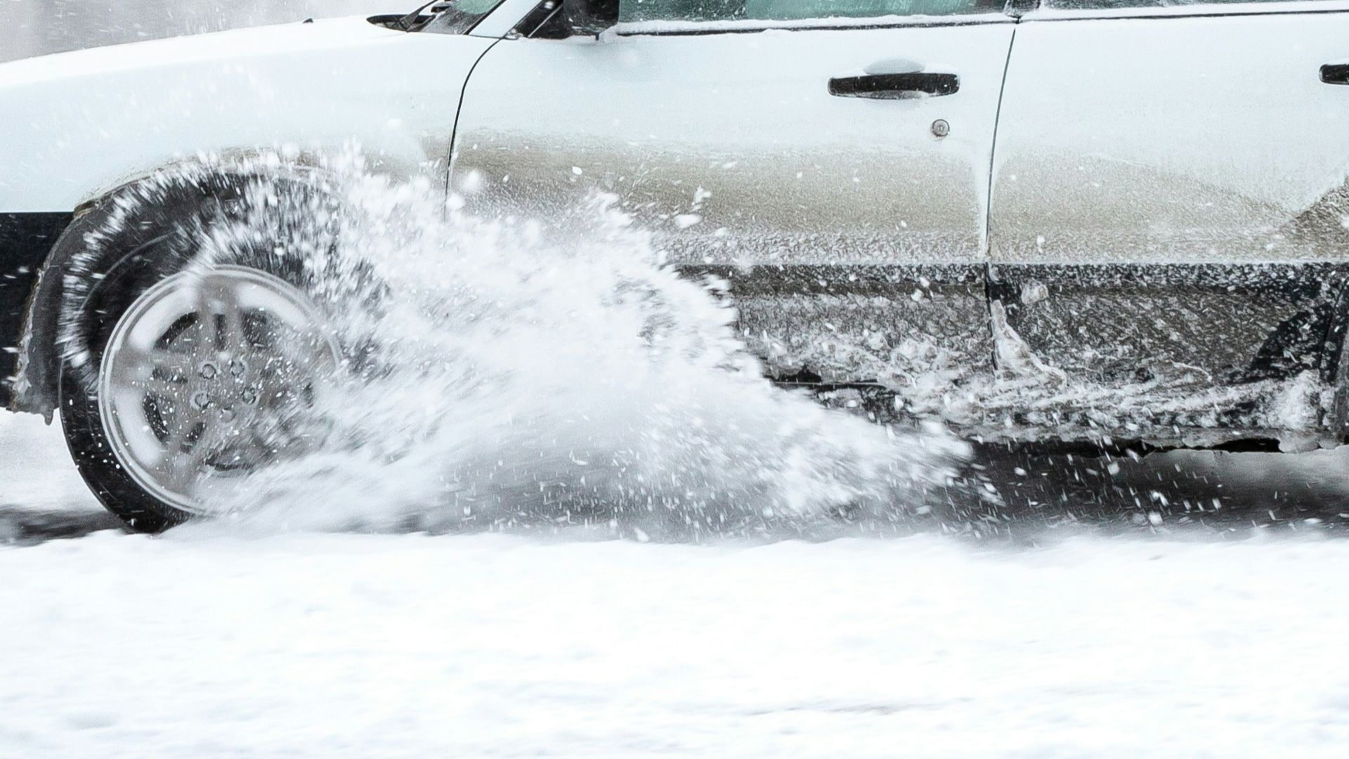 black suv on snow covered ground