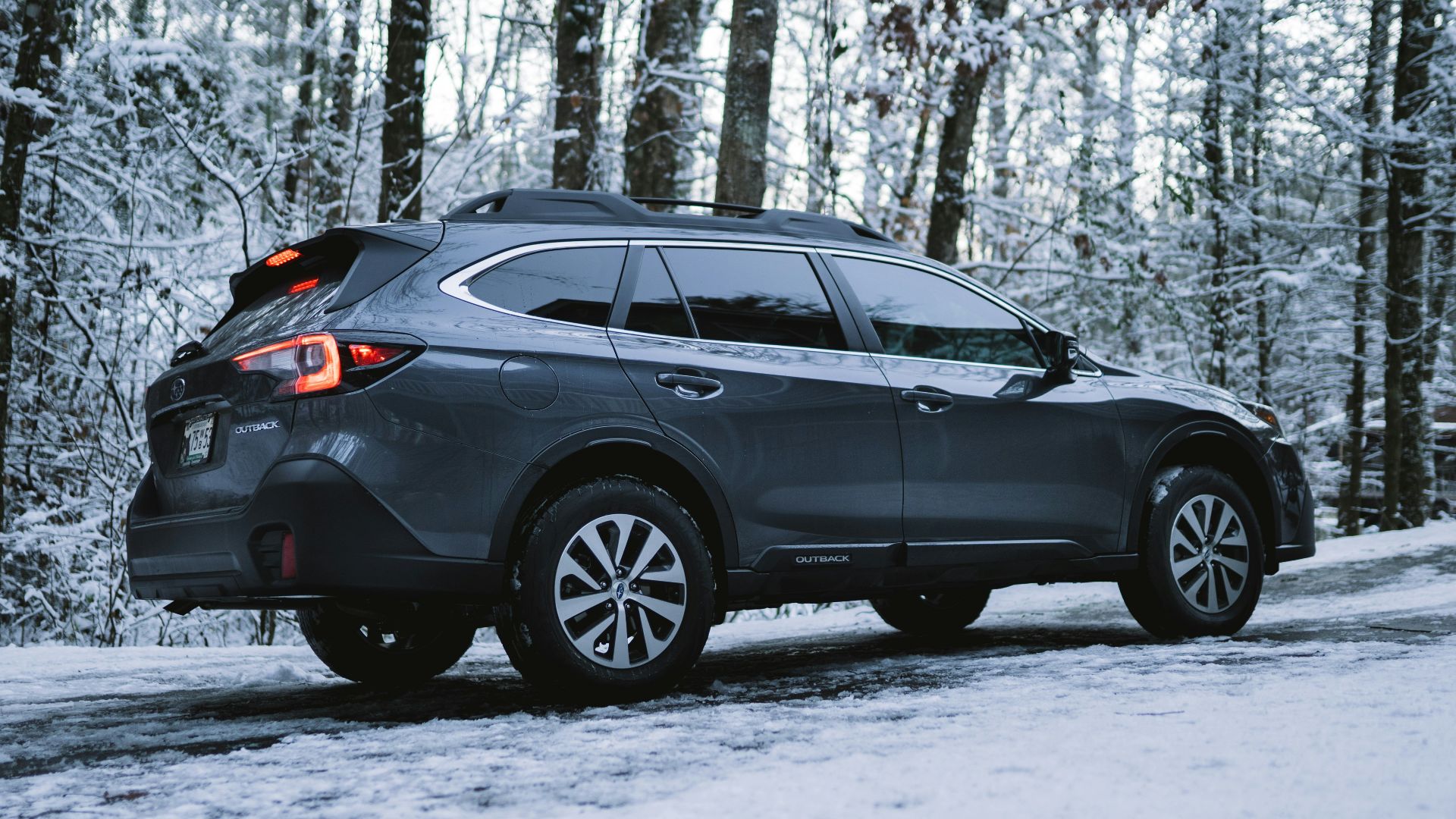black suv on snow covered ground