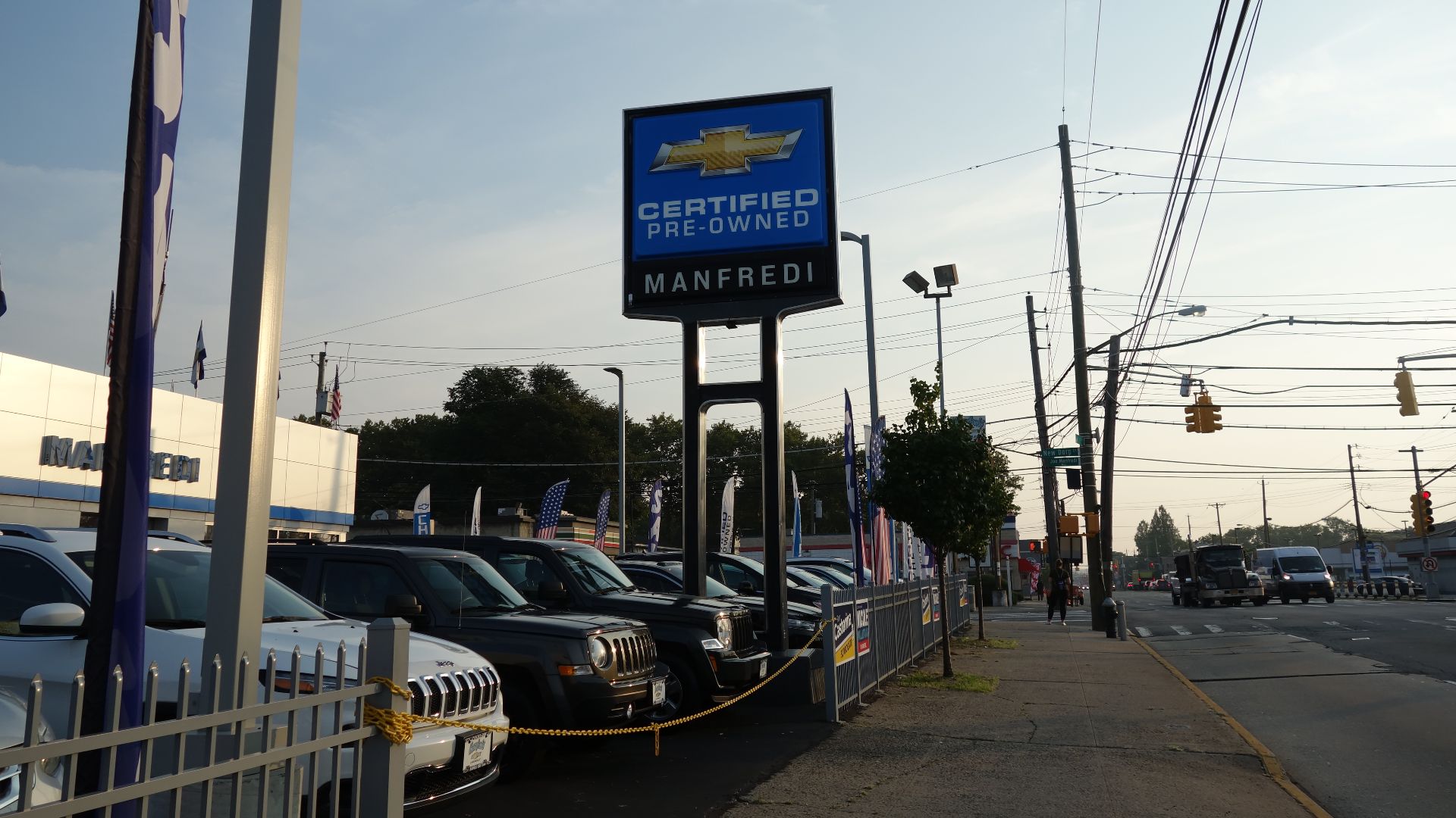 The Manfredi Chevrolet dealership at the northwest corner Hylan Boulevard and New Dorp Lane in New Dorp, Staten Island. This is the used car (certified pre-owned) section, where there are several Jeep vehicles.