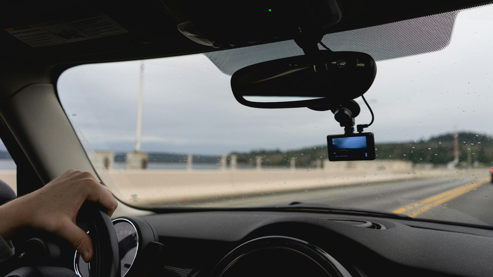 a person driving a car on a highway