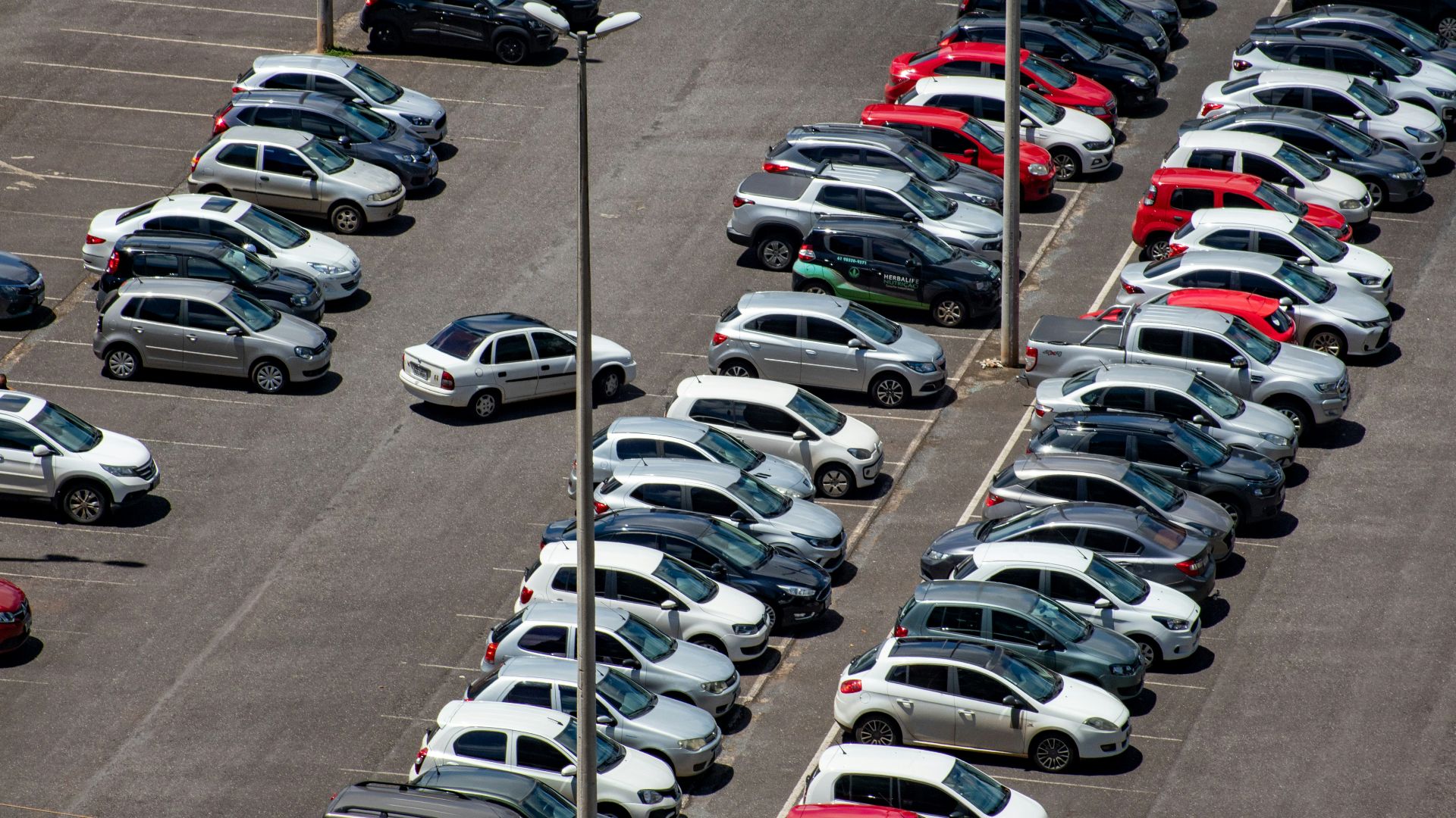 cars parked on parking lot during daytime