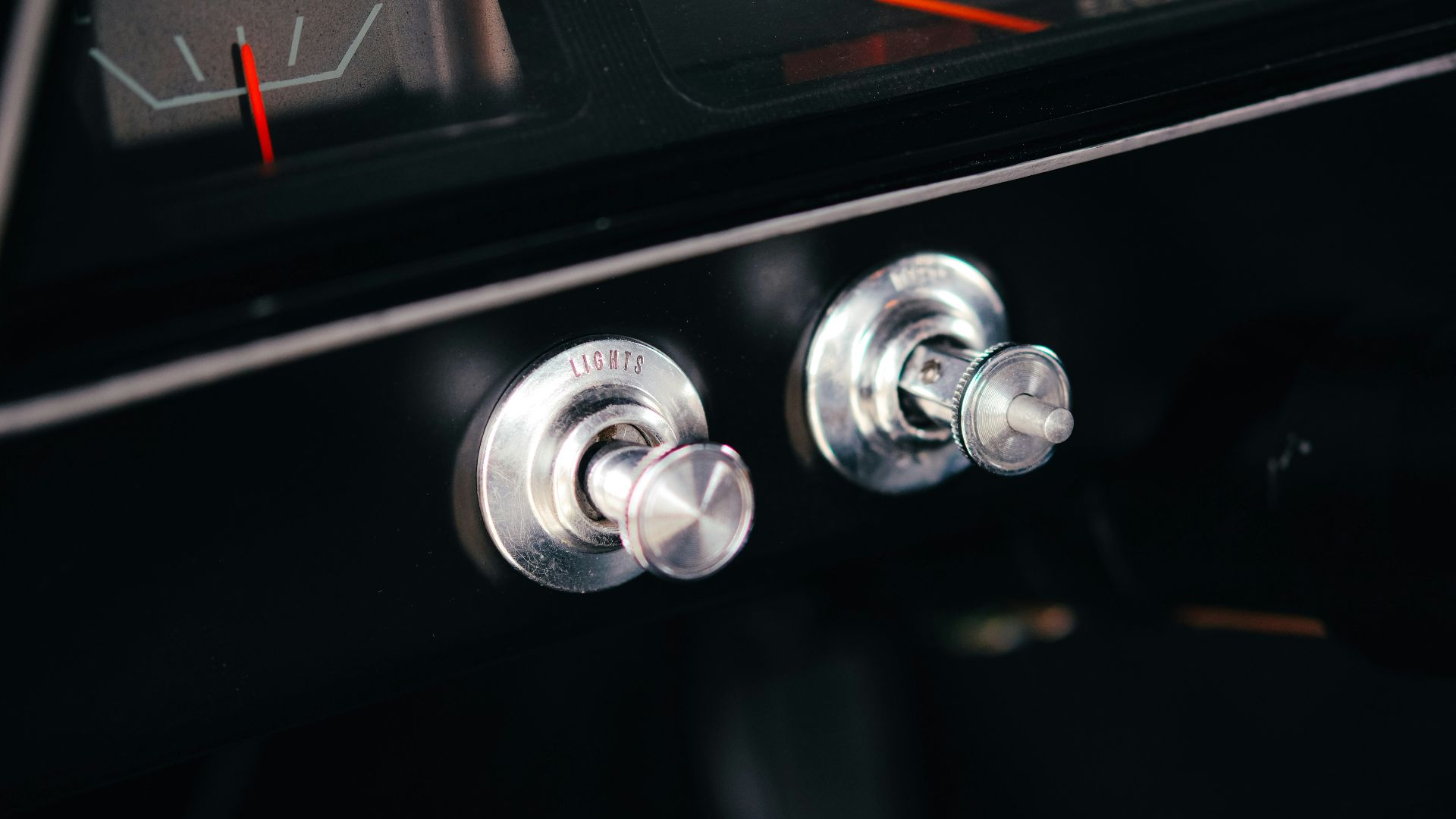 Close-up of vintage car dashboard with fuel gauge.