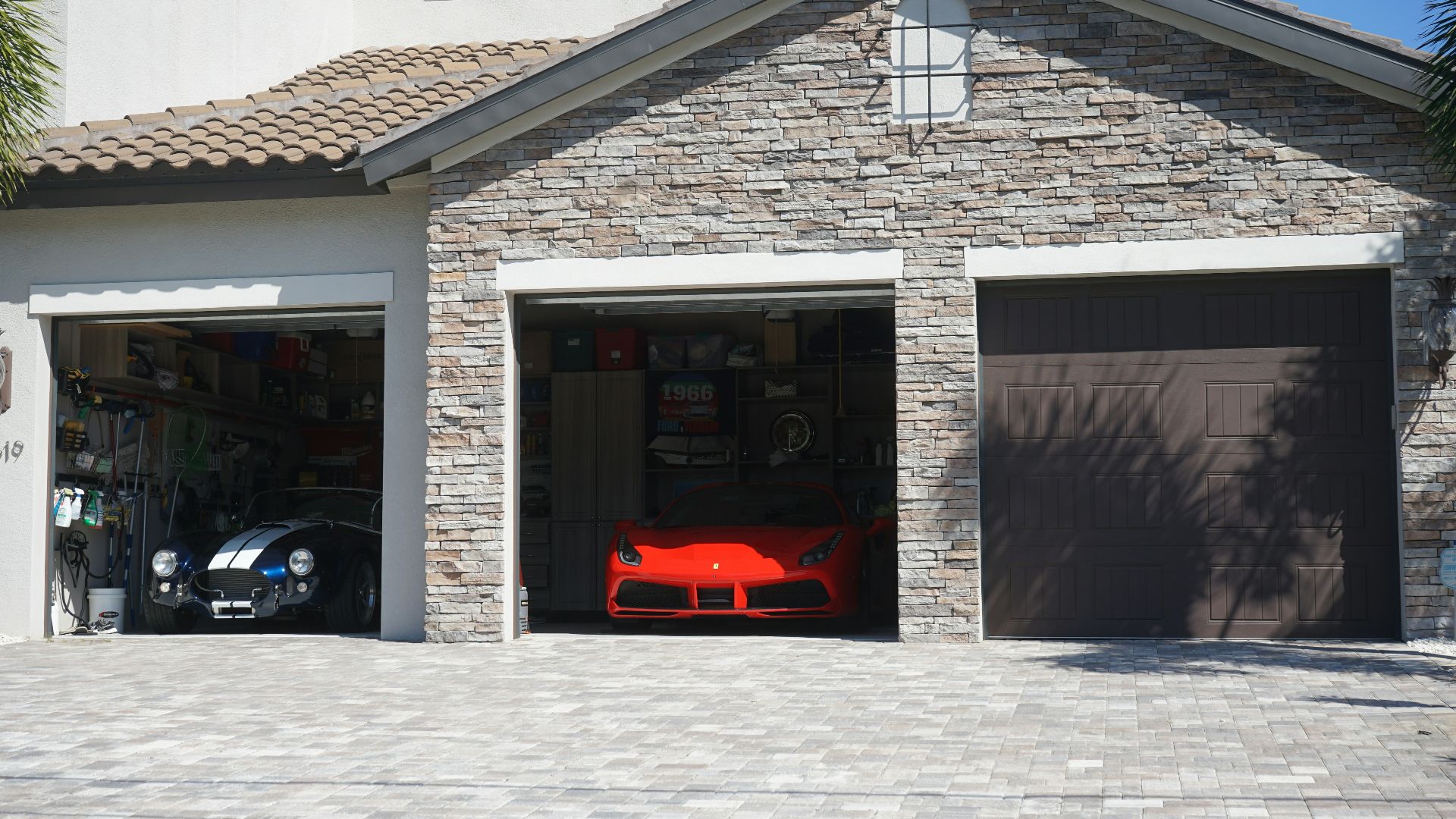 a car is parked in the garage of a house