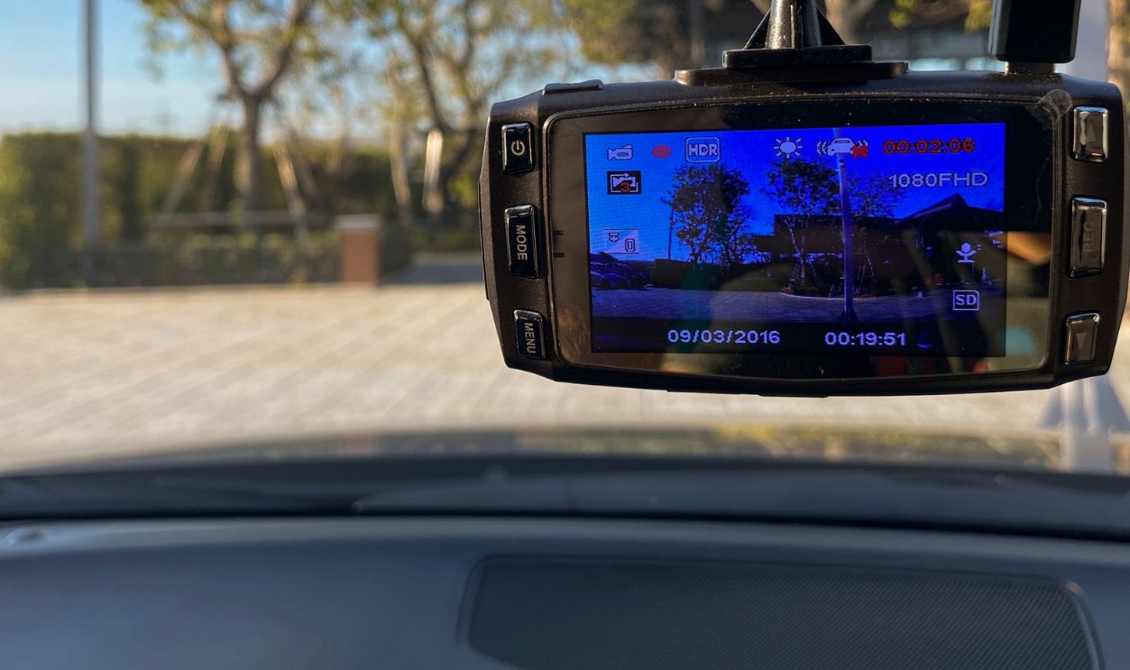 Camera cam in car, video record while car driving on the rode for witness and evidence.