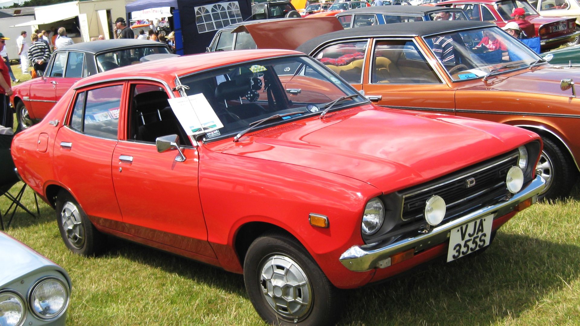Datsun Sunny (UK nomenclature of the time). The adjacent car on the left of the picture is a Lancia.