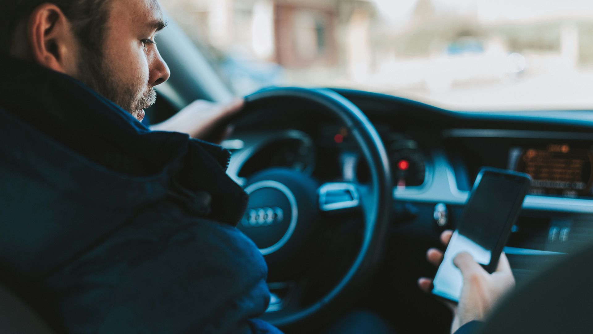man holding black smartphone