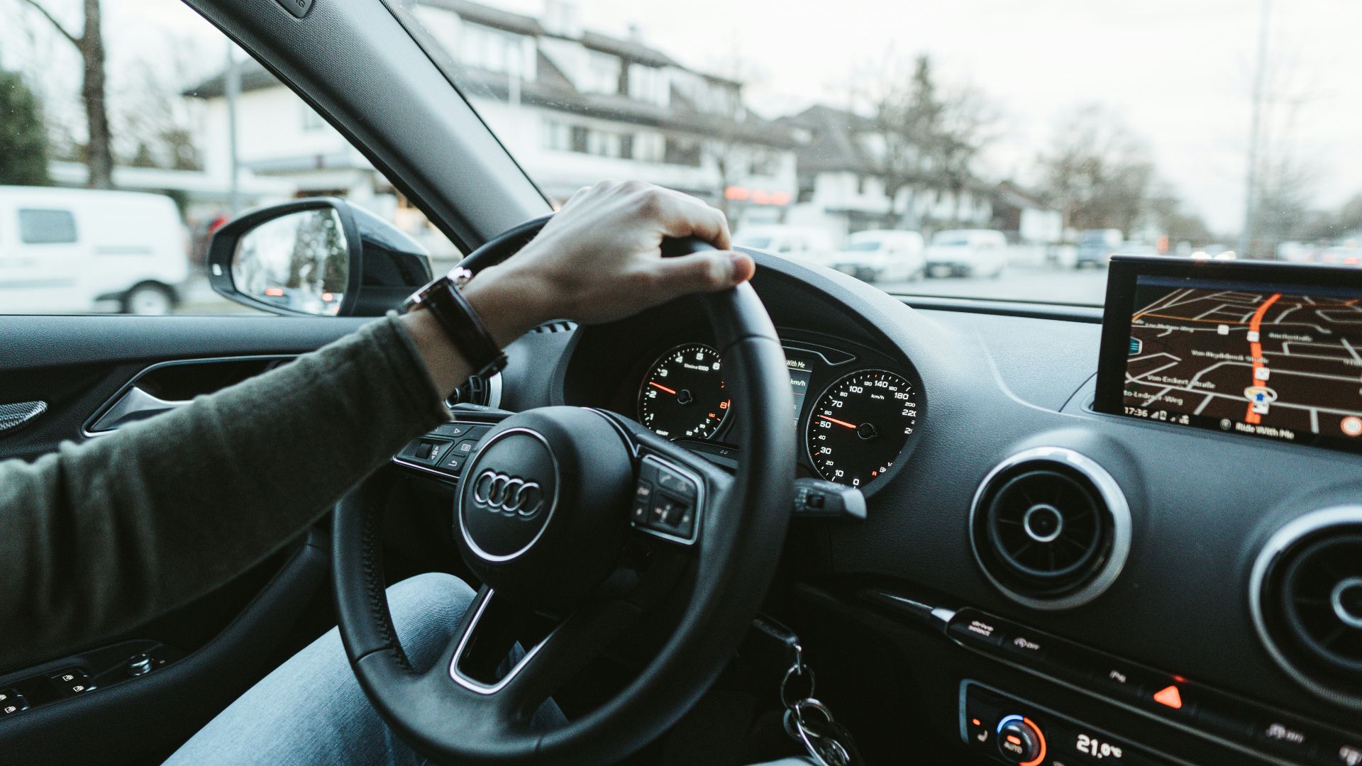 person driving car during daytime