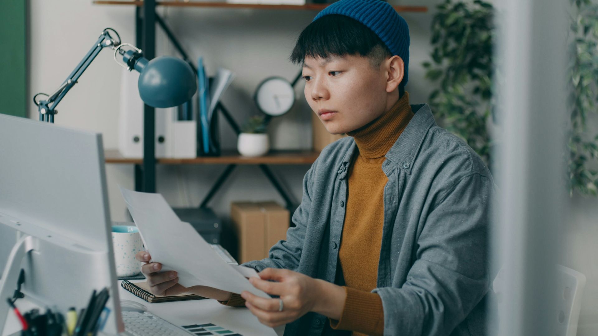 A person sitting at a desk with a computer