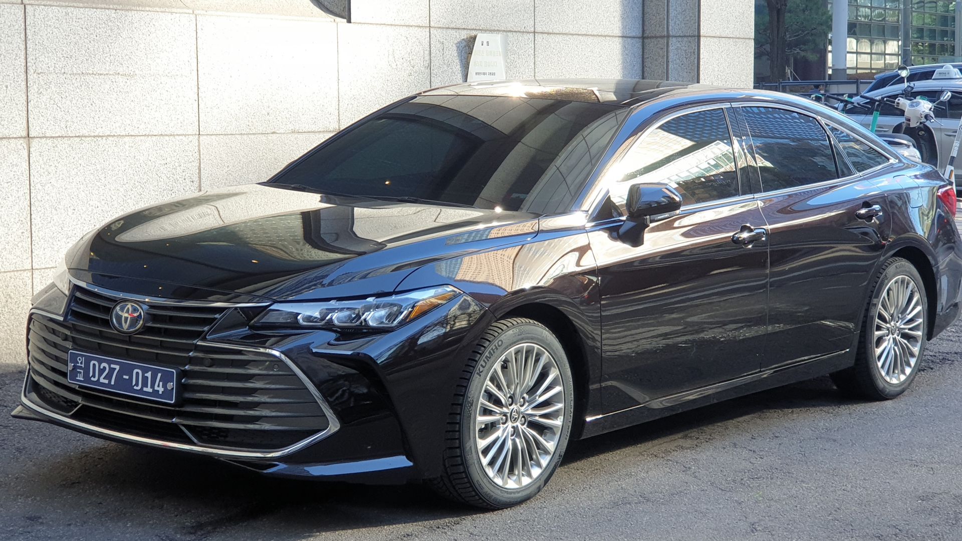Diplomatic Attitude Black Toyota Avalon Hybrid XLE XX50 sedan.