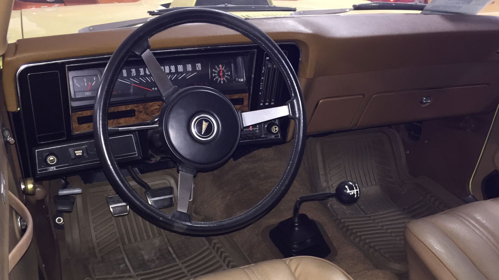 Interior view from driver's side of 1974 Pontiac Ventura with GTO option - this car is in factory original condition finished in yellow