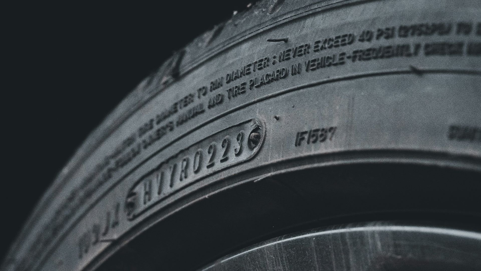 a close up of a tire on a black background