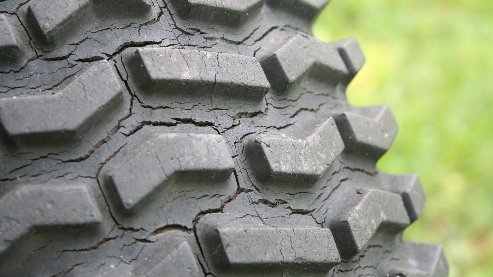Tire showing weather-cracking over long-term exposure to the weather.