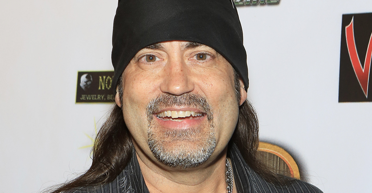 Danny Koker wearing a black head scarf