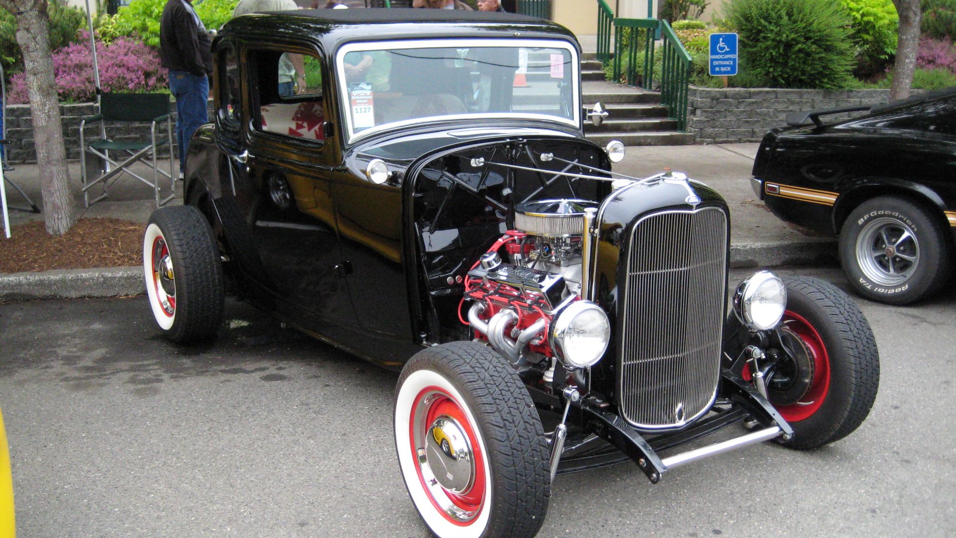 Black with red wheels is elegant.