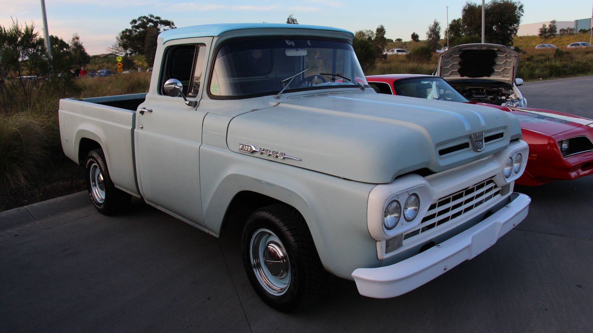 Ford had been producing factory made pickup trucks since 1925.
The F-100 was restyled in 1957, the third generation (1957-60)  Ford widened the front bodywork to integrate the cab and front fenders, the hood that now sat flush with the fenders. In the bac