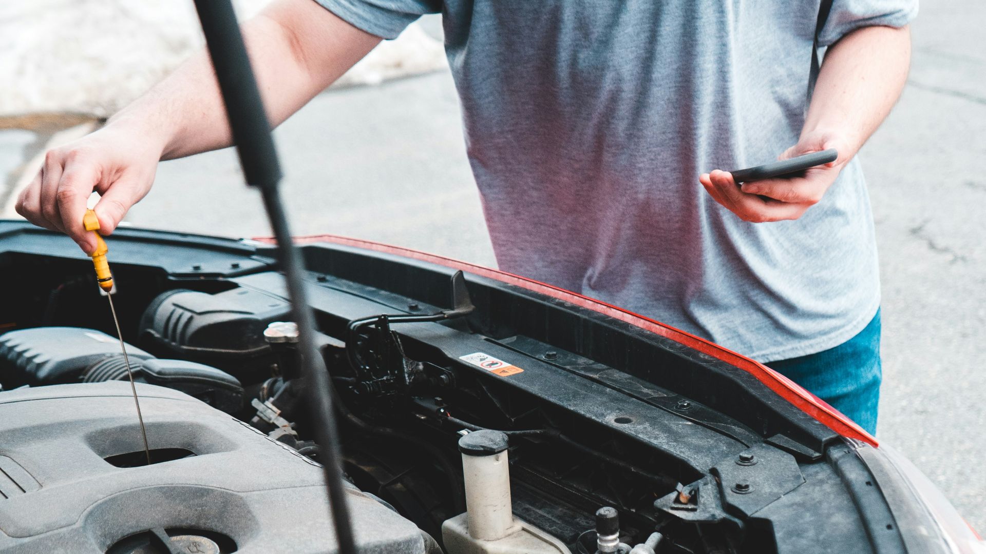 a man is working on a car engine