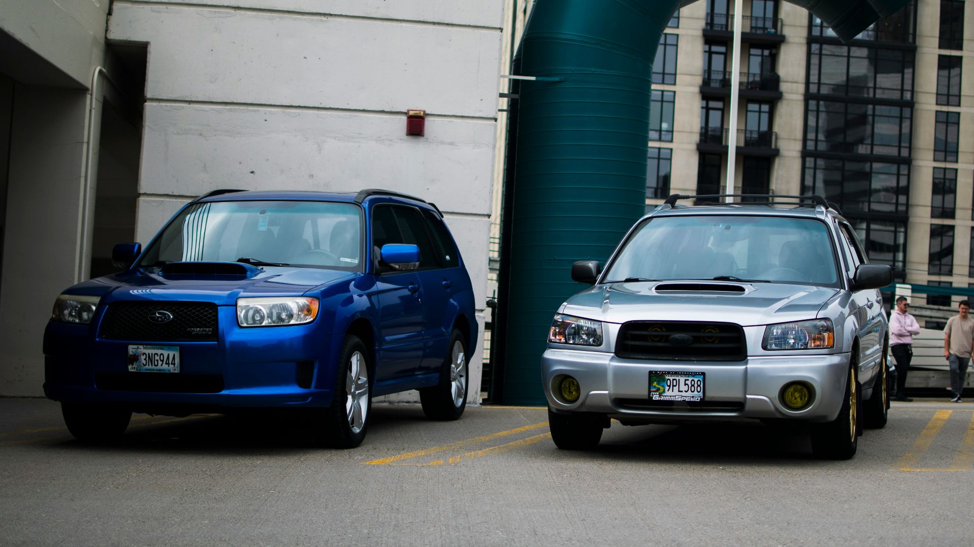 a couple of cars parked next to each other