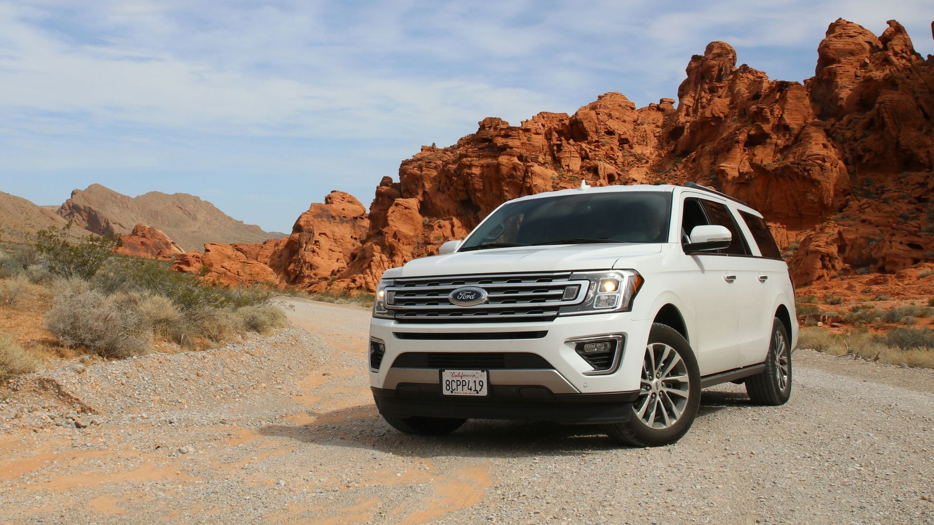 parked white Ford Explorer SUV