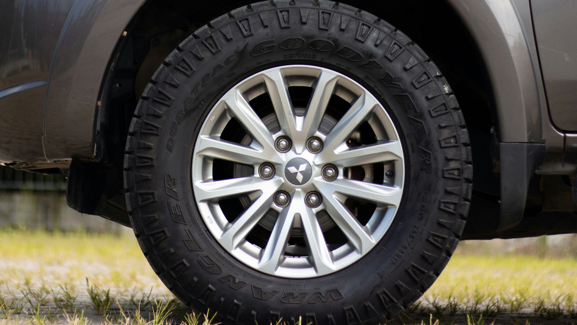gray car with gray wheel