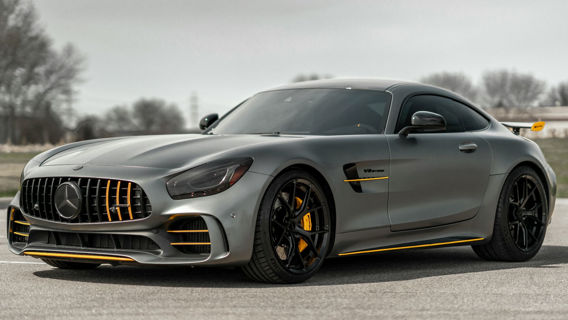 black mercedes benz coupe on gray asphalt road