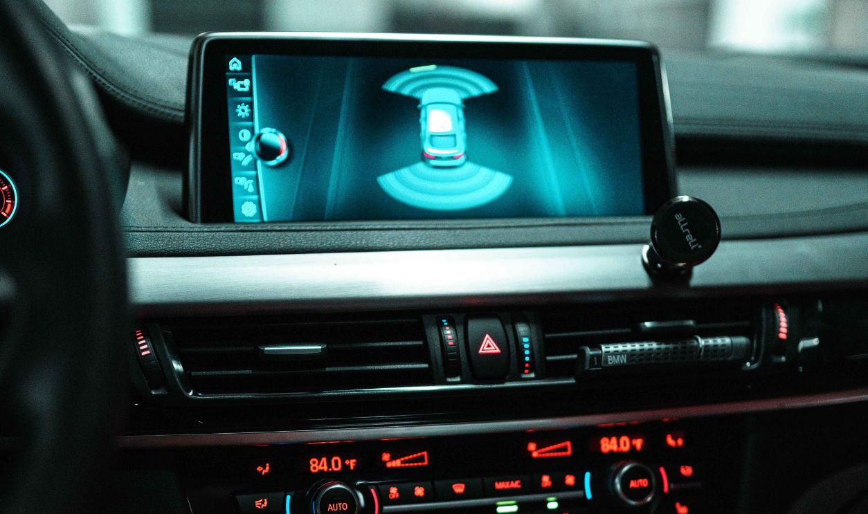 Close-up of a car dashboard with a digital screen