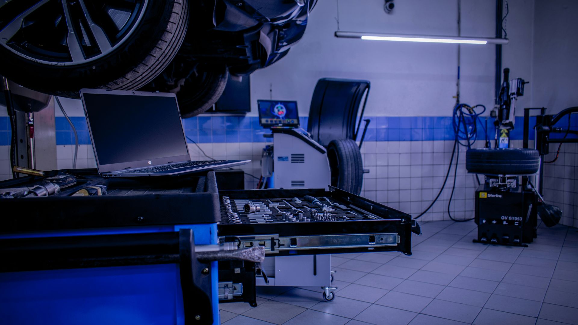 a room with a laptop and other equipment