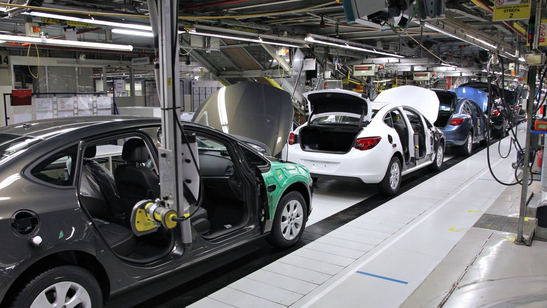 Car factory assembly line. Opel Astra J manufactured in General Motors Manufacturing Poland plant in Gliwice.